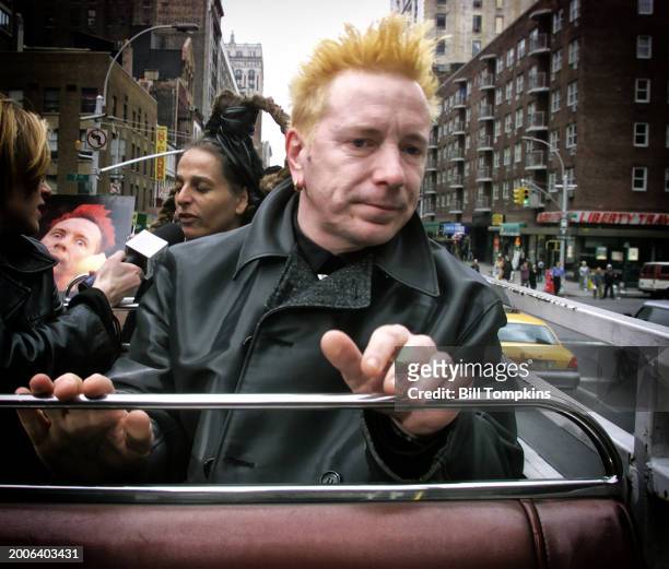 Bill Tompkins / Getty Images ) Punk rock singer John Lydon aka Johnny Rotten of the band The Sex Pistols and Public Image Limited with his...
