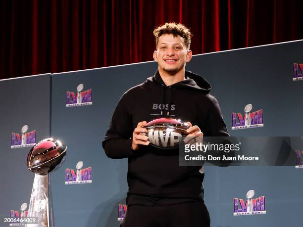 Quarterback Patrick Mahomes of the Kansas City Chiefs pose after being presented the Pete Rozelle Trophy as Super Bowl LVIII Most Valuable Players...