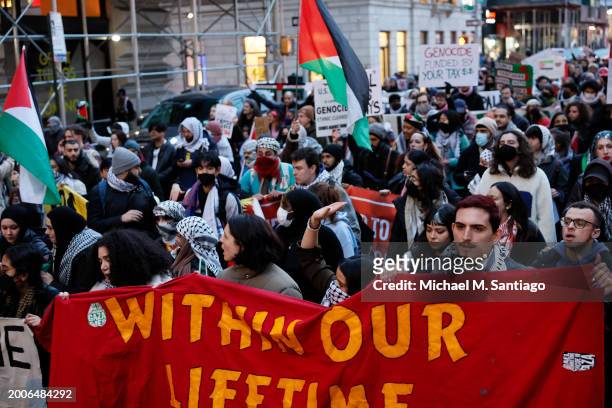 People march calling on Israel to stop its Rafah invasion in Gaza on February 12, 2024 in New York City. Israel launched airstrikes into Rafah...