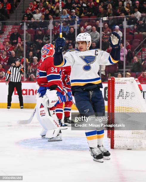 Brayden Schenn of the St. Louis Blues celebrates a goal by teammate Colton Parayko during the first period against the Montreal Canadiens at the Bell...