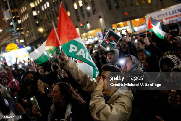 People gather for a rally calling on Israel to stop its Rafah invasion in Gaza at the Fox Corporation headquarters on February 12, 2024 in New York...