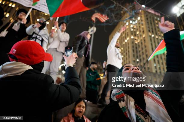 People gather for a rally calling on Israel to stop its Rafah invasion in Gaza at the Fox Corporation headquarters on February 12, 2024 in New York...