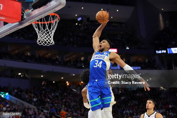 Giannis Antetokounmpo of the Milwaukee Bucks dunks against the Denver Nuggets during the first half of a game at Fiserv Forum on February 12, 2024 in...