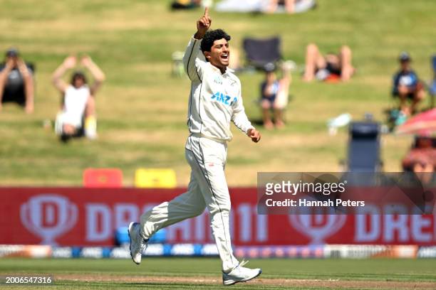 Rachin Ravindra of the New Zealand Black Caps celebrates the wicket of Keegan Petersen of South Africa during day one of the Men's Second Test in the...