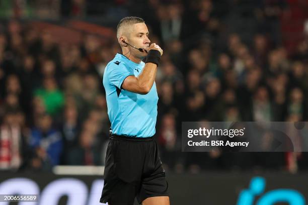 Referee Radu Petrescu blows his whistle during the UEFA Europe League Play Offs match between Feyenoord and AS Roma at Stadion Feijenoord on February...