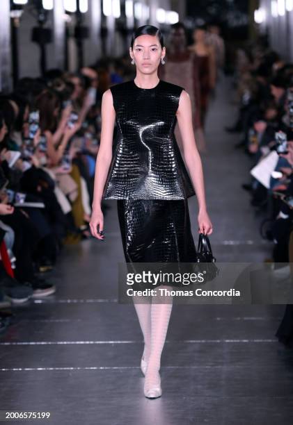 Model walks the runway during Tory Burch Fall/Winter 2024 New York Fashion Week at New York Public Library on February 12, 2024 in New York City.