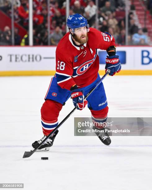 David Savard of the Montreal Canadiens skates the puck during the second period against the St. Louis Blues at the Bell Centre on February 11, 2024...