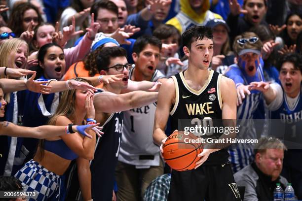 The Cameron Crazies taunt Parker Friedrichsen of the Wake Forest Demon Deacons during the second half of the game against the Duke Blue Devils at...