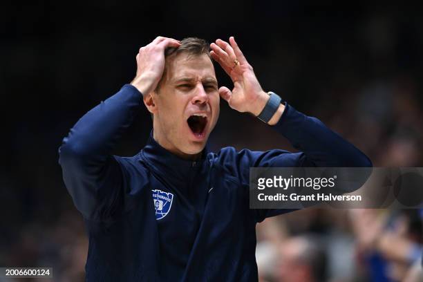 Head coach Jon Scheyer of the Duke Blue Devils reacts to a call by the officials during the second half of the game against the Wake Forest Demon...