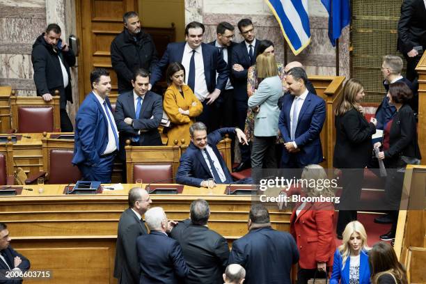 Kyriakos Mitsotakis, Greece's prime minister, center, waits with other lawmakers for the results of a vote on the same-sex marriage bill in...