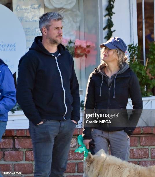 Renee Zellweger and Ant Anstead are seen on a leisurely stroll on February 13, 2024 in Newport Beach, California.