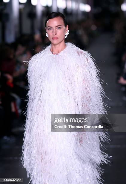 Irina Shayk walks the runway during Tory Burch Fall/Winter 2024 New York Fashion Week at New York Public Library on February 12, 2024 in New York...