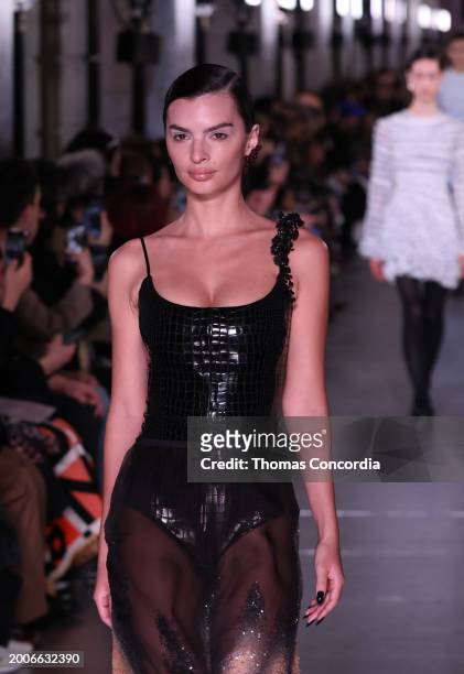 Emily Ratajkowskil walks the runway during Tory Burch Fall/Winter 2024 New York Fashion Week at New York Public Library on February 12, 2024 in New...