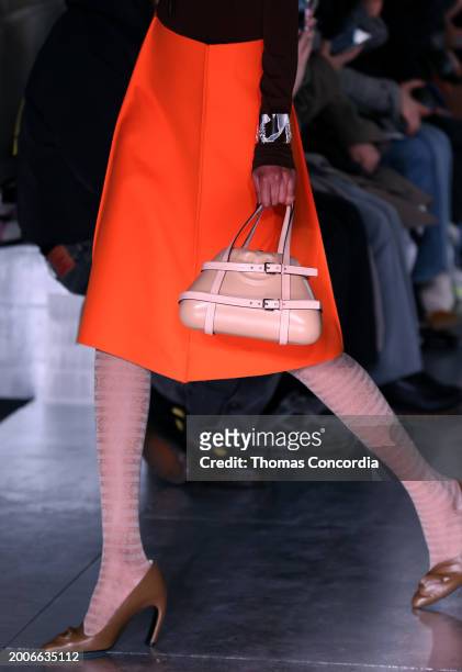 Model walks the runway, fashion detail, during Tory Burch Fall/Winter 2024 New York Fashion Week at New York Public Library on February 12, 2024 in...