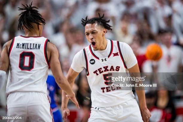 Darrion Williams of the Texas Tech Red Raiders shouts and high fives Chance McMillian after making a shot during the first half of the game against...
