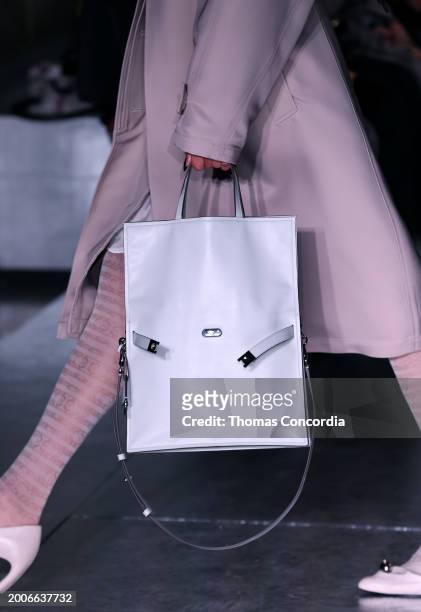 Model walks the runway, fashion detail, during Tory Burch Fall/Winter 2024 New York Fashion Week at New York Public Library on February 12, 2024 in...