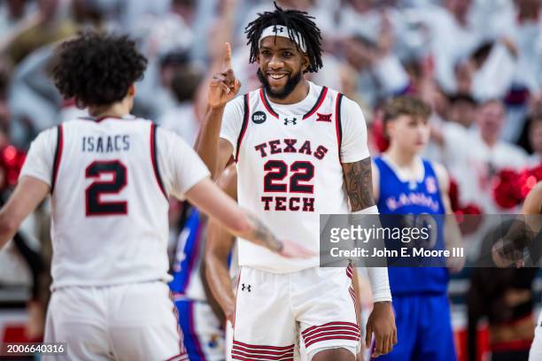 Warren Washington of the Texas Tech Red Raiders gestures to Pop Isaacs during the first half of the game against the Kansas Jayhawks at United...