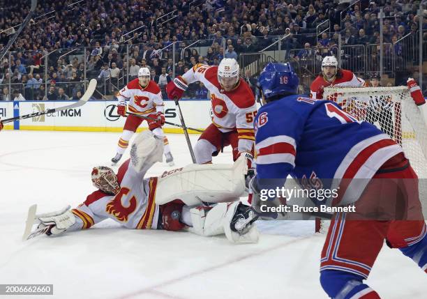 Jacob Markstrom of the Calgary Flames makes the third period save on Vincent Trocheck of the New York Rangers at Madison Square Garden on February...