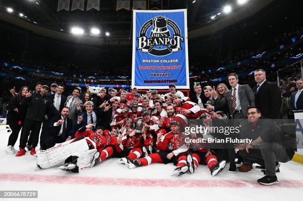 The Northeastern Huskies pose for a photo after winning the 2024 Men's Beanpot Tournament Championship Game against Boston University at the TD...
