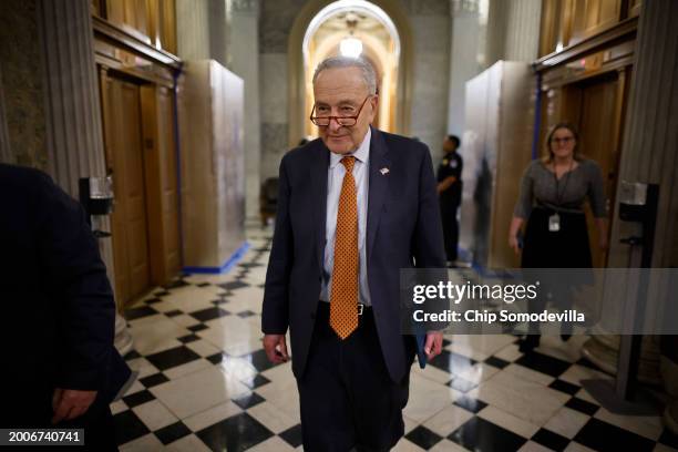 Senate Majority Leader Charles Schumer walks out of the Senate Chamber following a series of votes at the U.S. Capitol on February 12, 2024 in...