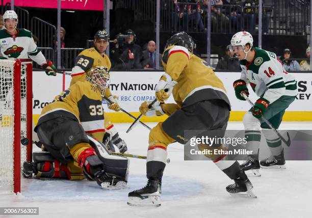 Joel Eriksson Ek of the Minnesota Wild scores a power-play goal against Adin Hill of the Vegas Golden Knights in the first period of their game at...