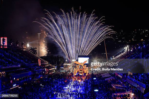 Fireworks explode as members of Portela perform during 2024 Carnival parades at Sapucai Sambodrome on February 12, 2024 in Rio de Janeiro, Brazil.