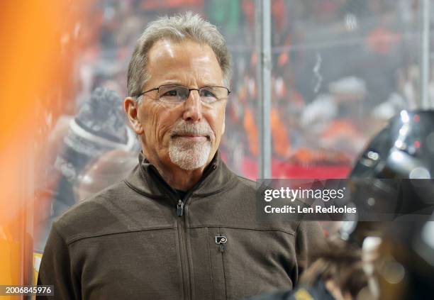 Head Coach of the Philadelphia Flyers watches the play on the ice during the first period against the Arizona Coyotes at the Wells Fargo Center on...