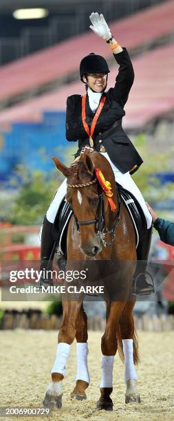 Philippa Johnson riding Benedict waves after her round in the equestrian freestyle at the Paralympic Games in Hong Kong on September 10, 2008....