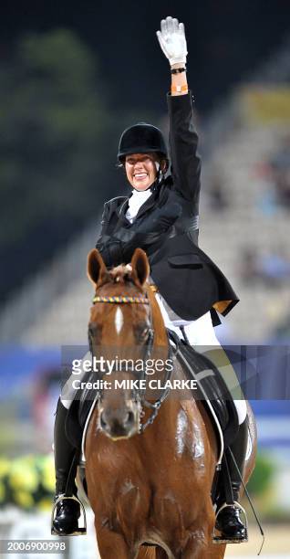 Philippa Johnson riding Benedict waves after her round in the equestrian freestyle at the Paralympic Games in Hong Kong on September 10, 2008....