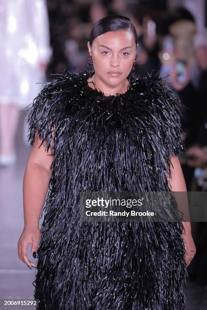 Paloma Elsesser walks the runway during the Tory Burch Fall/Winter 2024 Fashion Week show at New York Public Library on February 12, 2024 in New York...