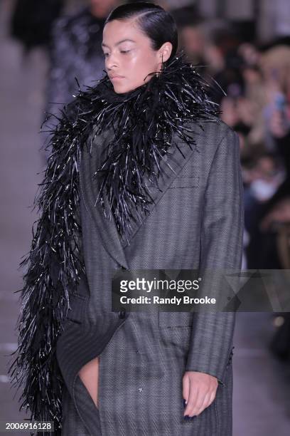 Model walks the runway during the Tory Burch Fall/Winter 2024 Fashion Week show at New York Public Library on February 12, 2024 in New York City.