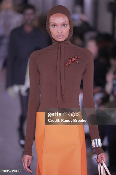 Model walks the runway during the Tory Burch Fall/Winter 2024 Fashion Week show at New York Public Library on February 12, 2024 in New York City.