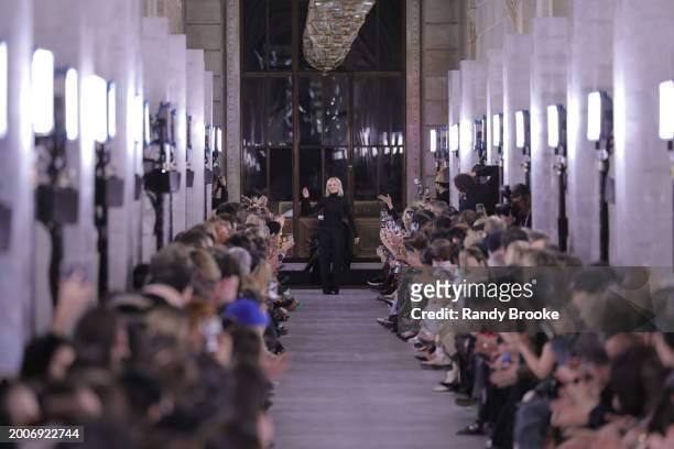 Tory Burch greets the audience after the Tory Burch Fall/Winter 2024 Fashion Week show at New York Public Library on February 12, 2024 in New York...