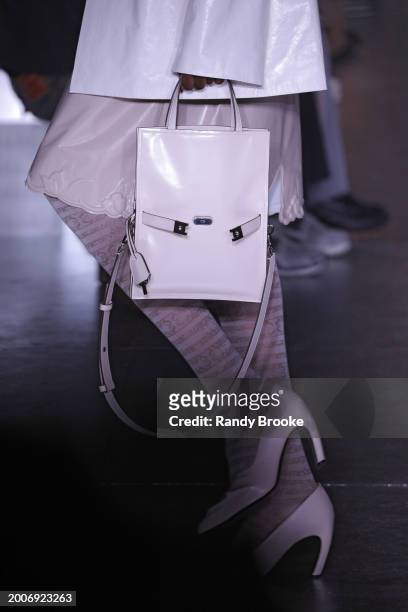 Handbag and white pumps during the Tory Burch Fall/Winter 2024 Fashion Week show at New York Public Library on February 12, 2024 in New York City.