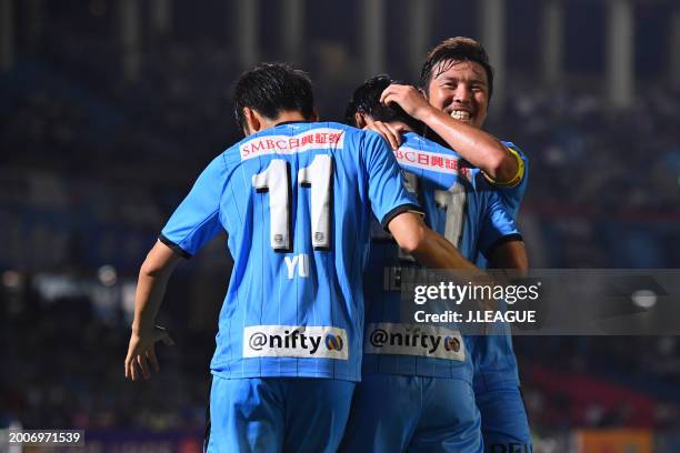 Akihiro Ienaga of Kawasaki Frontale celebrates with teammates Yu Kobayashi and Yusuke Tasaka after scoring the team's second goal during the J.League...