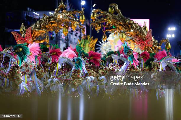Members of Mangueira perform during 2024 Carnival parades at Sapucai Sambodrome on February 12, 2024 in Rio de Janeiro, Brazil.
