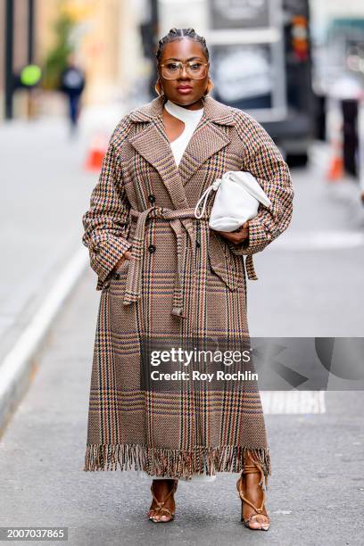 Funmi Ford wears a combination of Max Mara and Funmi outside the Pamella Roland Show at Starrett-Lehigh Building during New York Fashion Week on...