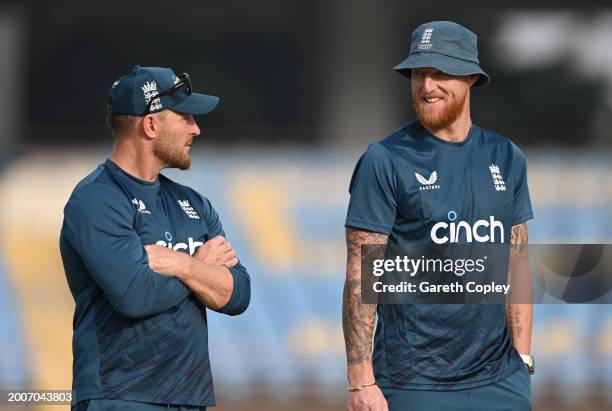 England captain Ben Stokes speaks with coach Brendon McCullum during a nets session at Saurashtra Cricket Association Stadium on February 13, 2024 in...