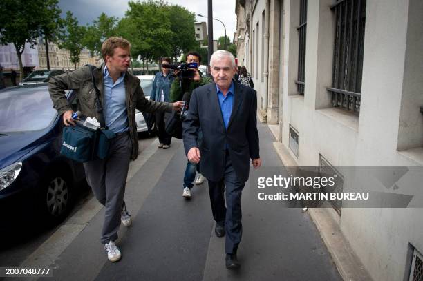 French former head of Les Renseignements Généraux Yves Bertrand walk next to journalists questions on June 10, 2011 upon his arrival at a police's...