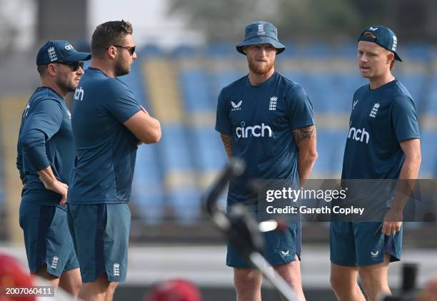 England captain Ben Stokes speaks with coach Brendon McCullum, Ollie Pope and selector Luke Wright during a nets session at Saurashtra Cricket...
