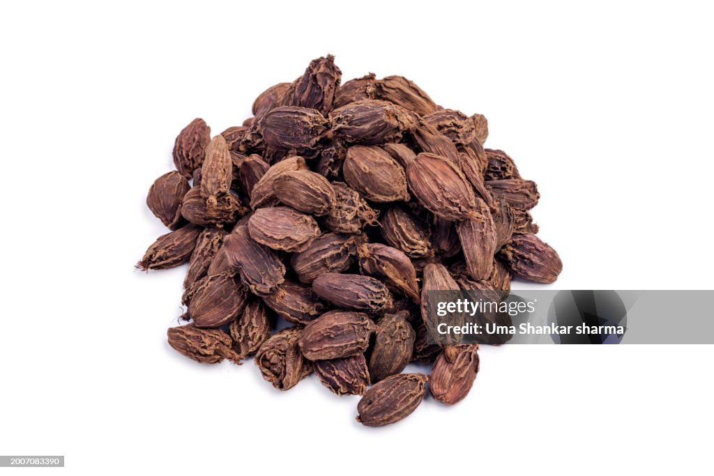 Black Cardamom (Tsaoko Fruit) On white.