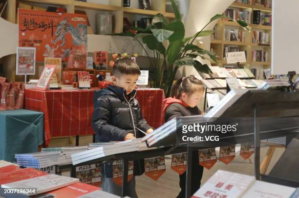 Children read books at a Zhongshuge bookstore to spend the Chinese Spring Festival holiday on February 13, 2024 in Yangzhou, Jiangsu Province of...