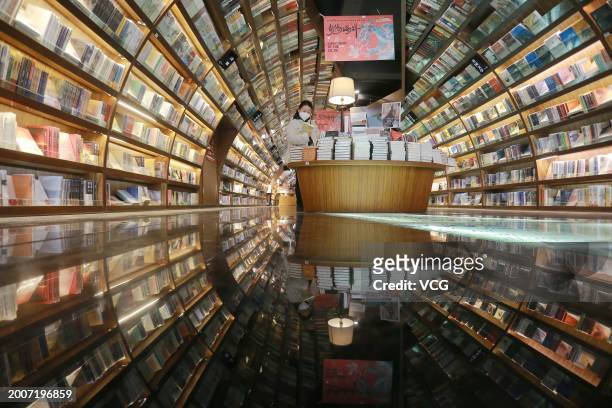 Citizen selects books at a Zhongshuge bookstore to spend the Chinese Spring Festival holiday on February 13, 2024 in Yangzhou, Jiangsu Province of...