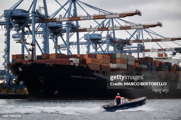 The Ningbo Express container ship of Hapag-Lloyd company is moored in the Psa Terminal of Genoa's Harbour, Northern Italy, on February 7, 2024.