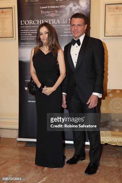 Chiara Lezzi and partener attends a photocall for "L'Orchestra Del Mare" at Teatro Alla Scala on February 12, 2024 in Milan, Italy.