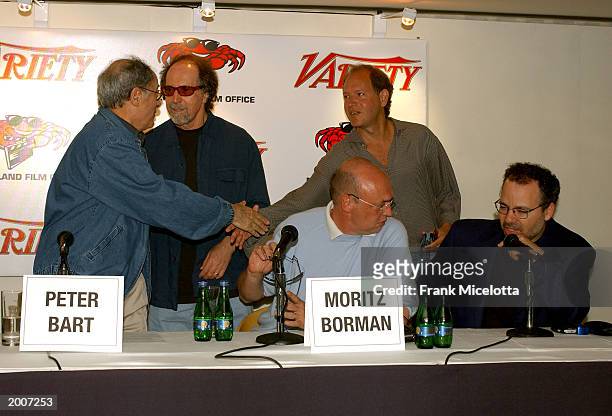 Variety's editor-in-cheif Peter Bart greets "Terminator 3: Rise of the Machines" producer Joel Micheals and shake hands with producer Hal Lieberman...