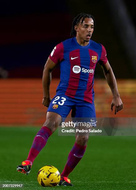 Jules Kounde of FC Barcelona with the ball during the LaLiga EA Sports match between FC Barcelona and Granada CF at Estadi Olimpic Lluis Companys on...