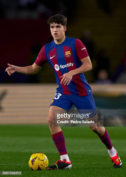 Pau Cubarsi of FC Barcelona with the ball during the LaLiga EA Sports match between FC Barcelona and Granada CF at Estadi Olimpic Lluis Companys on...