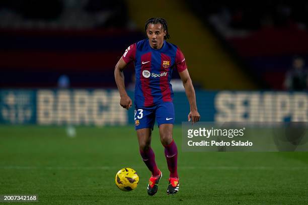 Jules Kounde of FC Barcelona with the ball during the LaLiga EA Sports match between FC Barcelona and Granada CF at Estadi Olimpic Lluis Companys on...