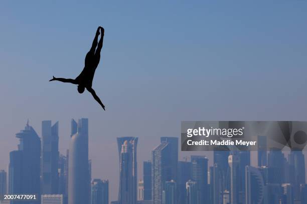 Matthias Appenzeller of Team Switzerland competes in the Men's 27m High Diving Rounds 1 & 2 on day twelve of the Doha 2024 World Aquatics...